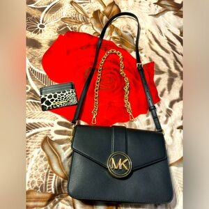 Beautiful black brand new crossbody never used and a beautiful card holder